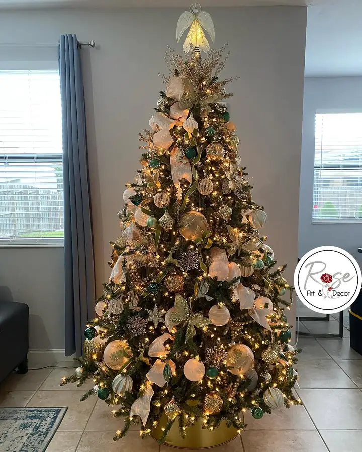 Red and gold Christmas tree designed and installed by Rose Art and Decor in a Miami living room